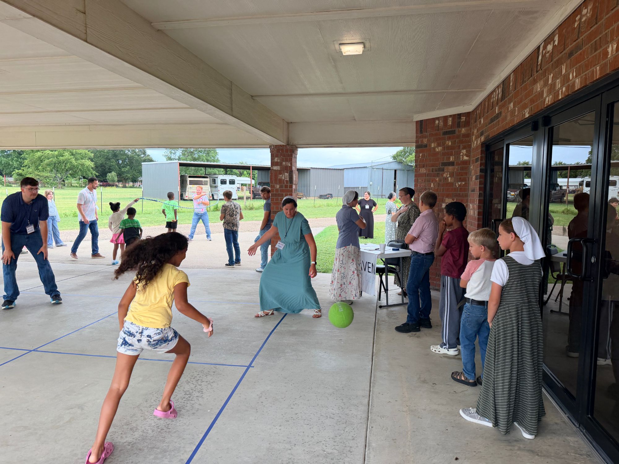 Kids playing together outside at a Haven Kids Club event